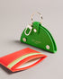 WMELON-Gifts-The WMELON set includes a faux leather watermelon keyring and vibrant card holder, perfect for adding a pop of colour to your everyday essentials. The keyring is shaped like a watermelon slice while the card holder features a sleek and simple design.The shell of this product is made with 52% recycled polyurethane. Using recycled polyurethane helps divert plastic waste from ending in landfills and helps us to reduce our dependency on virgin materials. Keyring and card holder set Watermelon desig